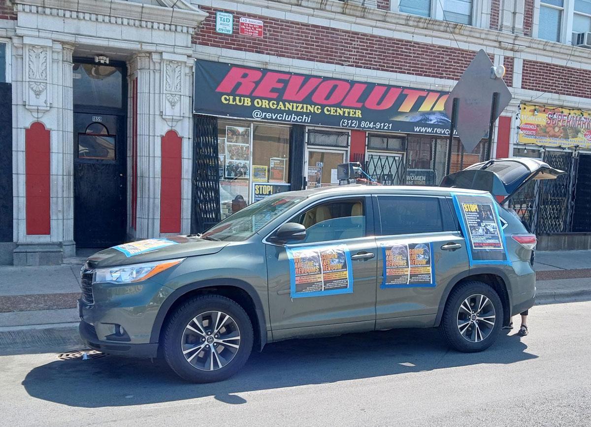 Chicago Revolution Club car decorated for outing to distribute We Are the Revcoms.