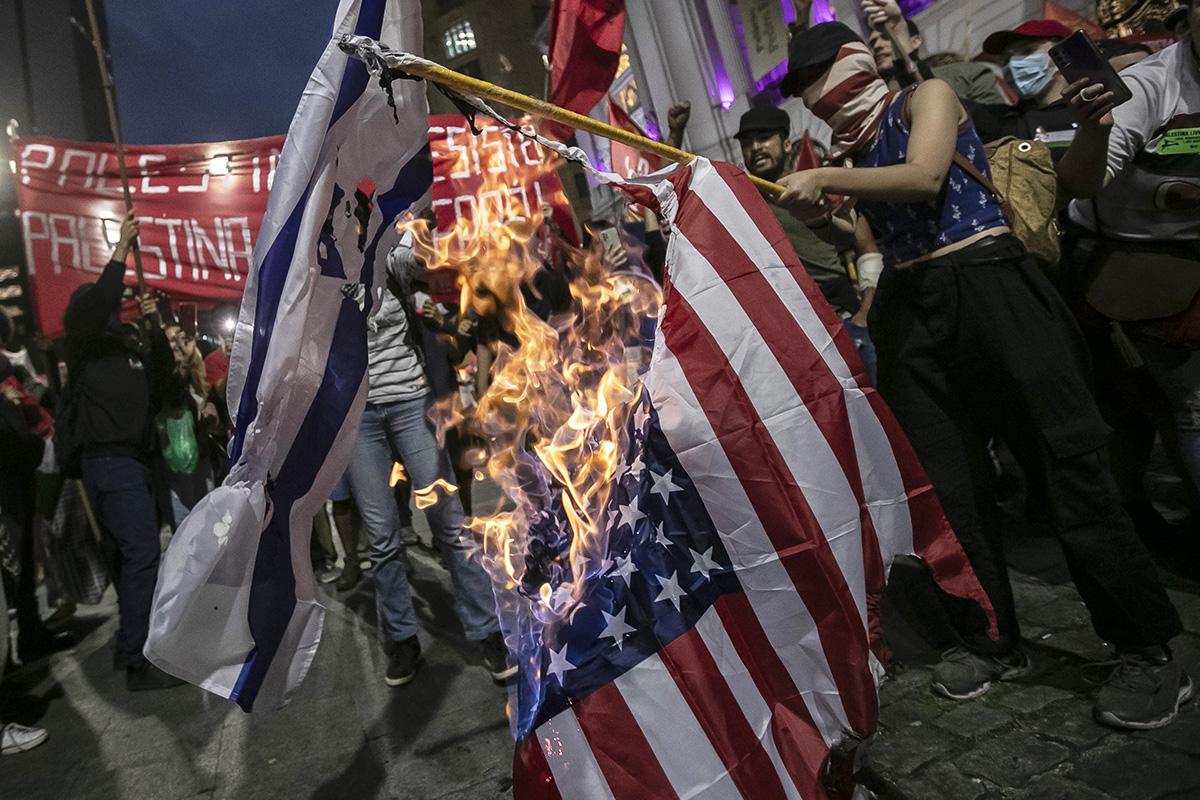 Rio de Janeiro, Brazil, protestors burn Israeli and American flags, October 19, 2023.