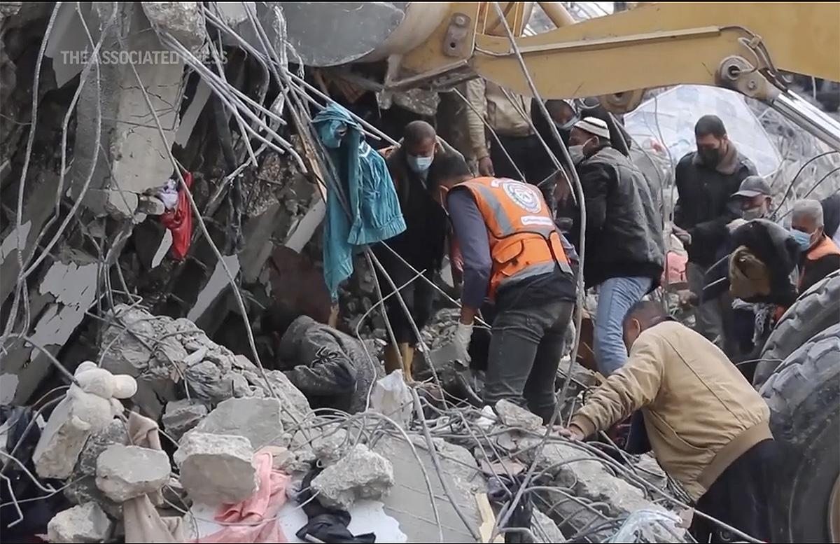 People search for survivors in rubble from Israeli strike on Central Gaza, February 24, 2024.