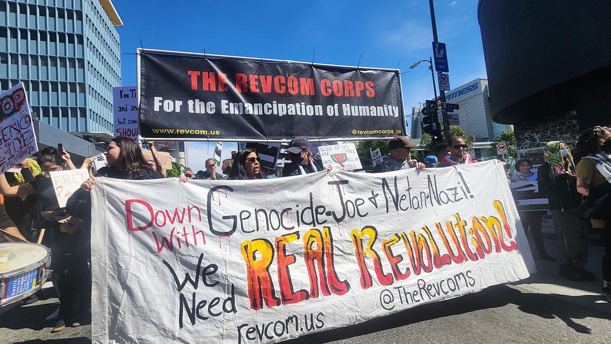 RevComCorps protest at the Oscars with big banner for Revolution.