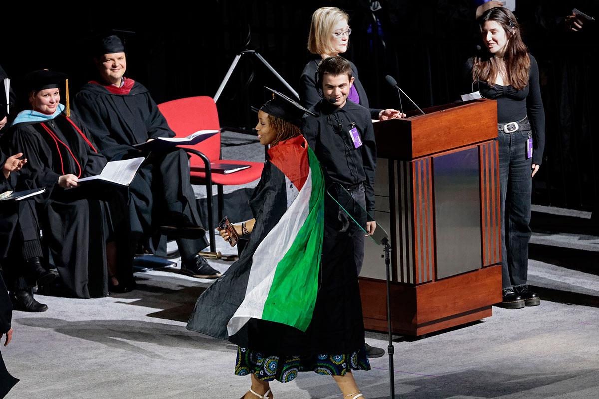At Emerson College in Boston, graduate wears Palestine flag cape, May 12, 2024.