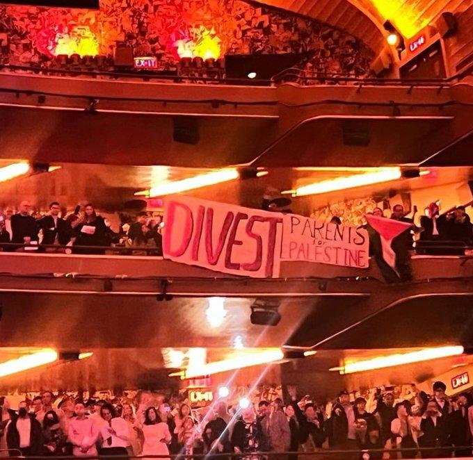 At Barnard College graduation Parents for Palestine drop banner that says "Divest-Parents for Palestine"