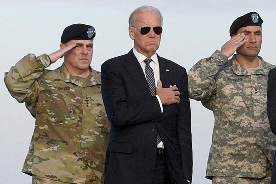 Genocide Joe Biden when he was Vice President with Army Chief of Staff Gen. Mark Milley, Vice President Joe Biden at Dover Air Force Base, Del in 2016.