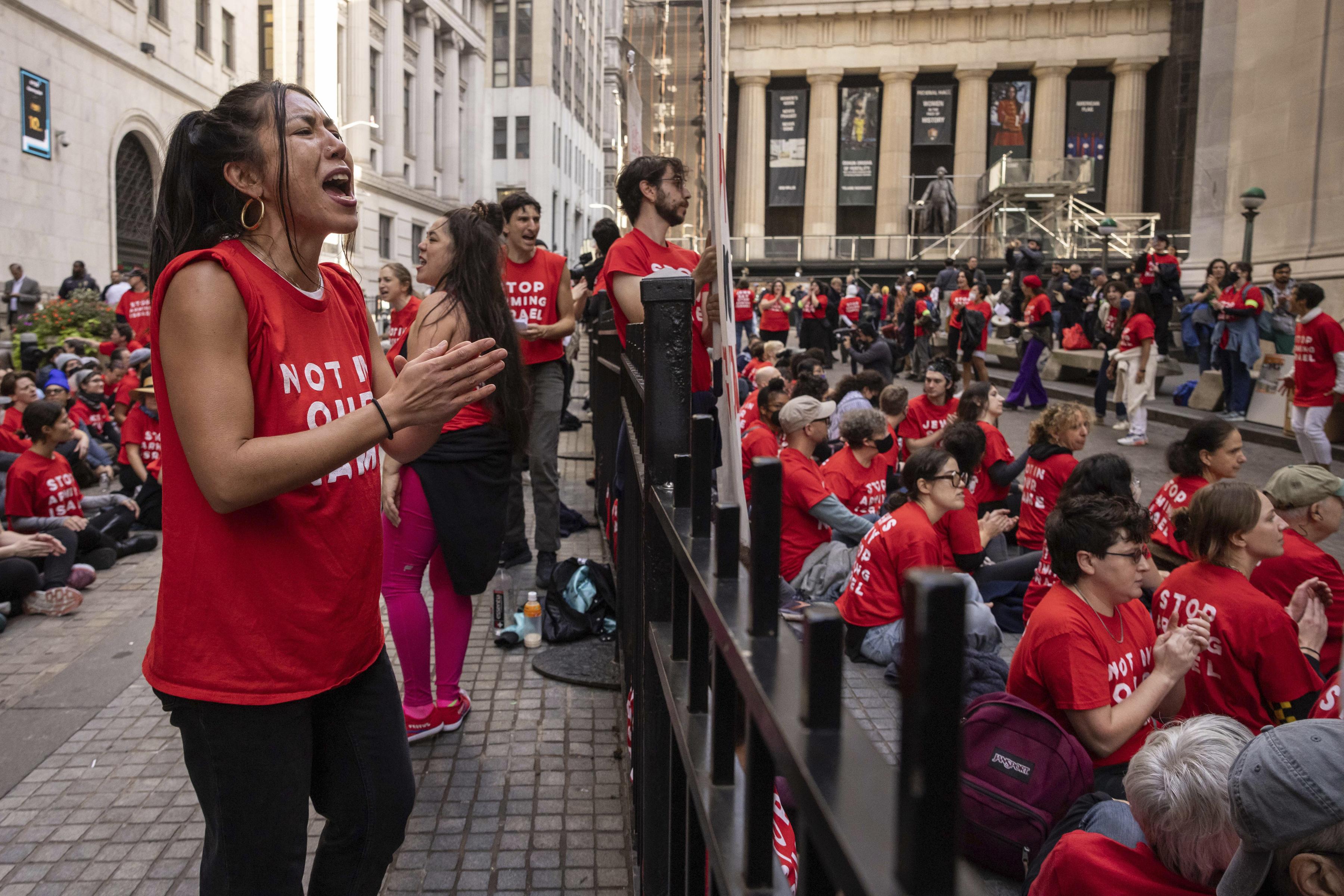 Protestors against war in the Middle East occupy an area outside the New York Stock Exchange, October 14, 2024.