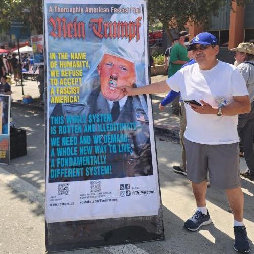 Man giving the finger to Mein Trumpf.