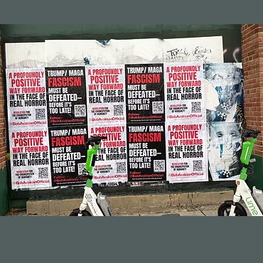 BobAvakianOfficial posters up on a wall.