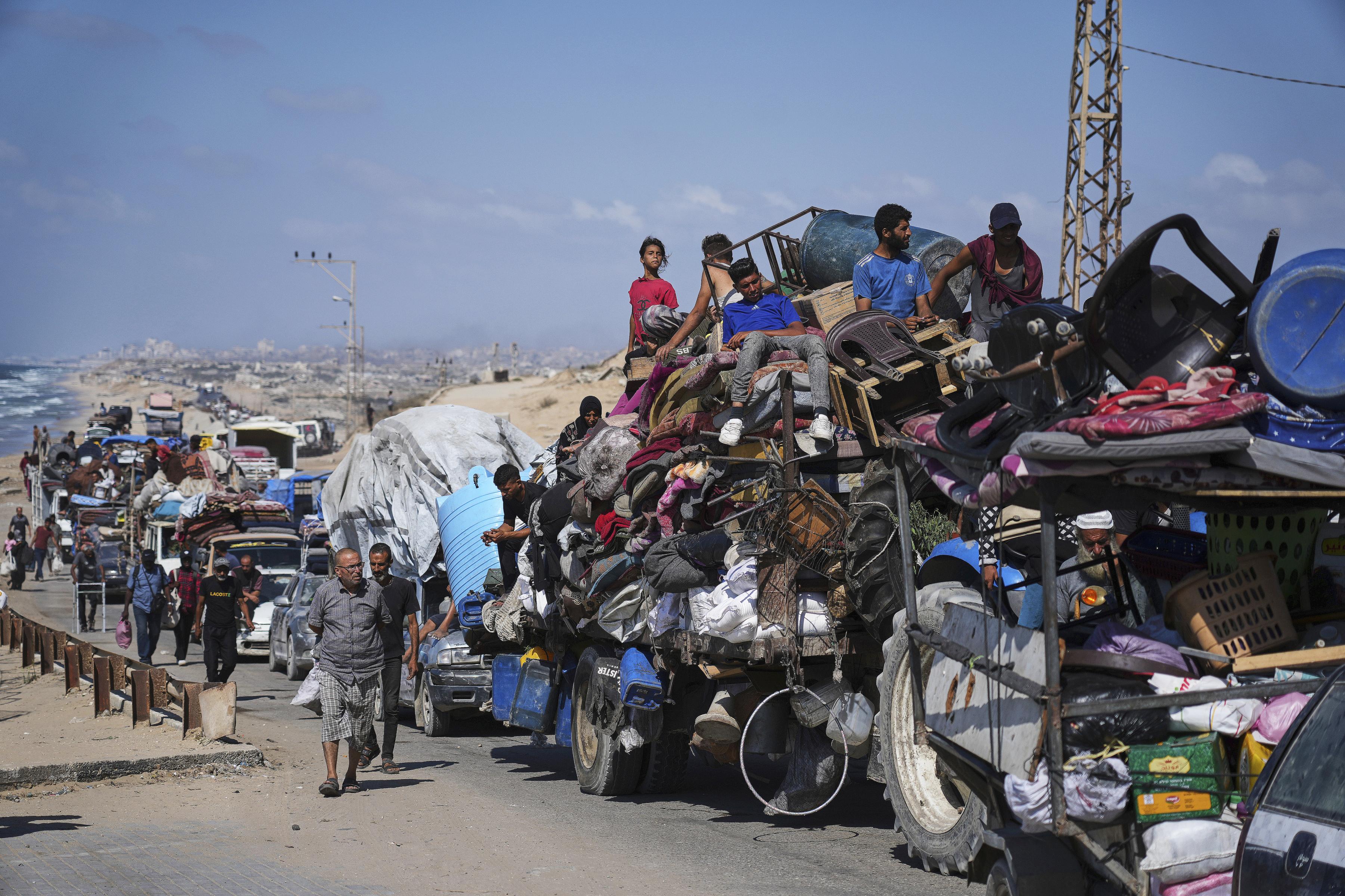 Displaced Palestinians flee along coastal road toward southern Gaza, September 9, 2025.