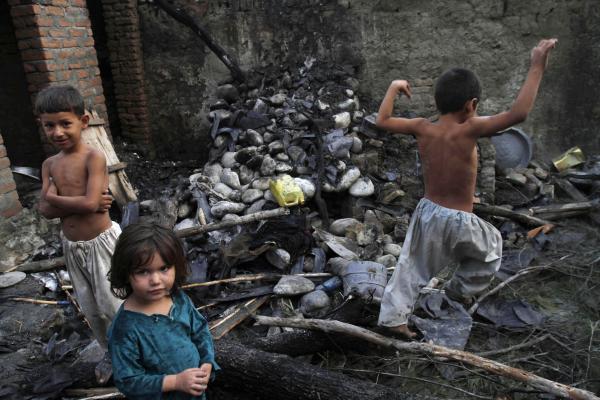 Afghani kids play in rubble from U.S. drone strike