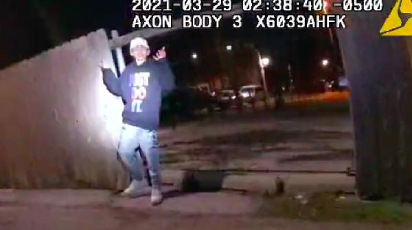 13-year-old Adam Toledo with hands up on cops video cam