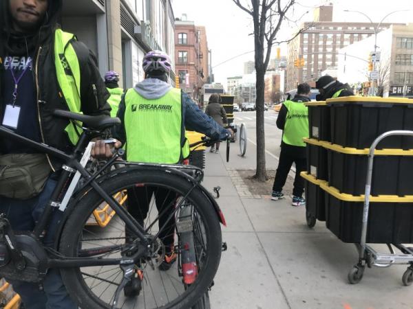Whole Foods delivery people lined up on their bikes