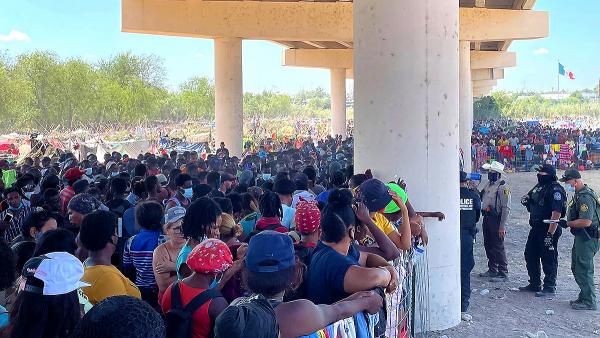 Thousands of immigrants, many from Haiti, wait under bridge in Del Rio, Texas.