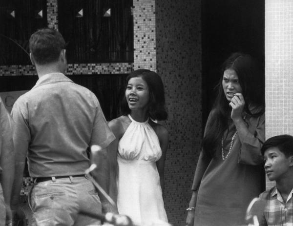 Women at a bar and passing U.S. soldiers in Saigon on May 28, 1971.