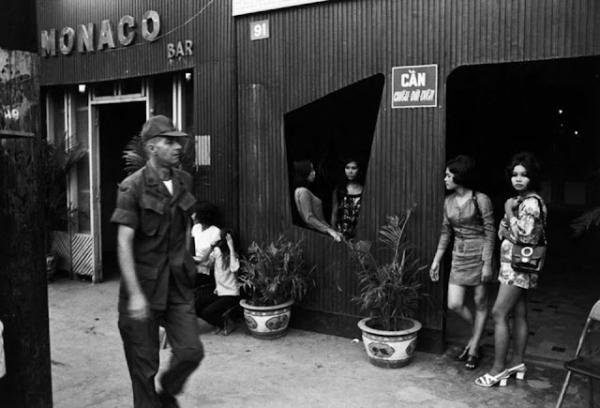 U.S. GI walks past South Vietnam brothel