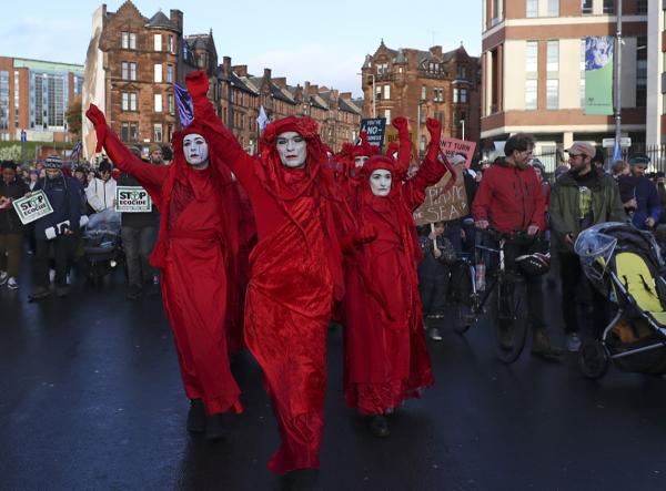 Extinction Rebellion protesters dressed in red, London, November 6, 2021.