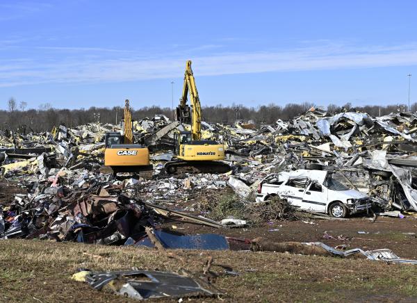 Extensive rubble surrounding candle factory after tornado hit Mayfield, Kentucky.