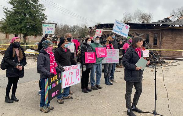 Rally at Planned Parenthood house destroyed by arson New Year's Eve.