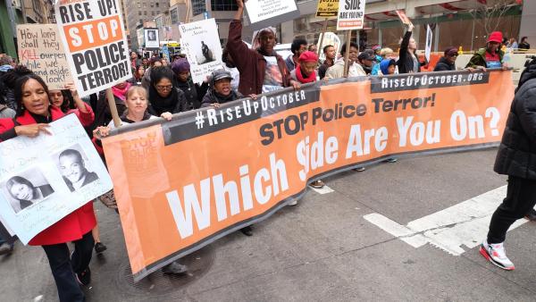 Which Side Are You On banner during Rise Up October protest against police brutality.