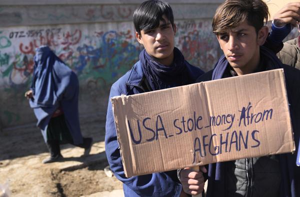 Afghani boys protest Biden's decision to freeze assets in Afghanistan.