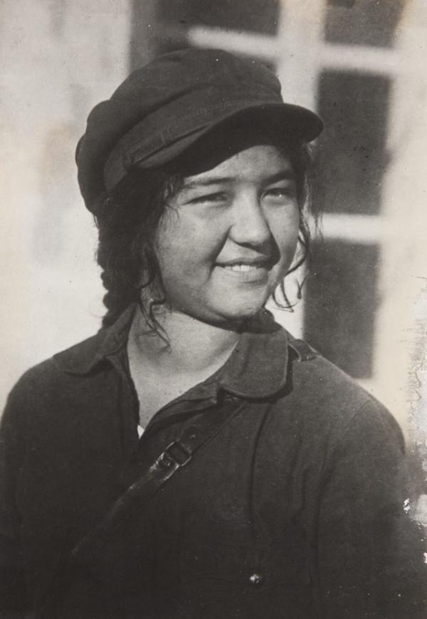 Smiling young woman farmer