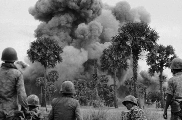 Smoke rises from bombs dropped by U.S. planes near the Cambodian capital of Phnom Penh, July 25, 1973.