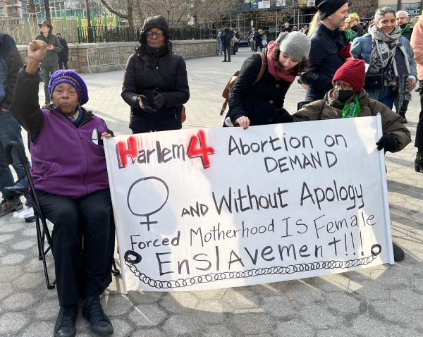 Women from Harlem with banner for International Women's Day rally, NYC.