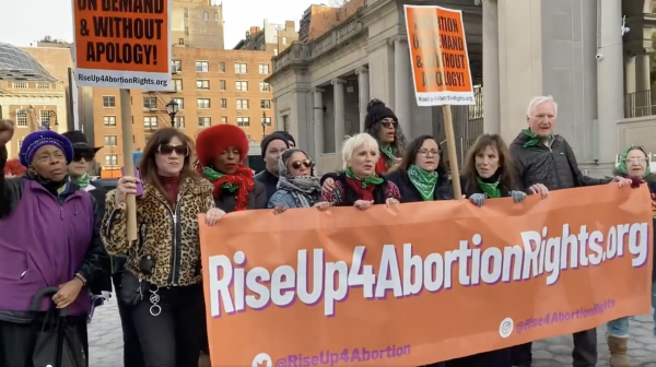Speakers with banner RiseUp4AbortionRights leading New York City IWD march.