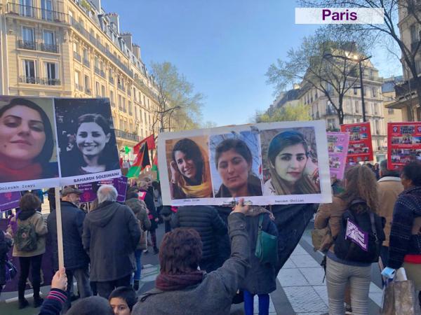 Paris International Women's Day posters of women demanding Free All Political Prisoners In Iran Now