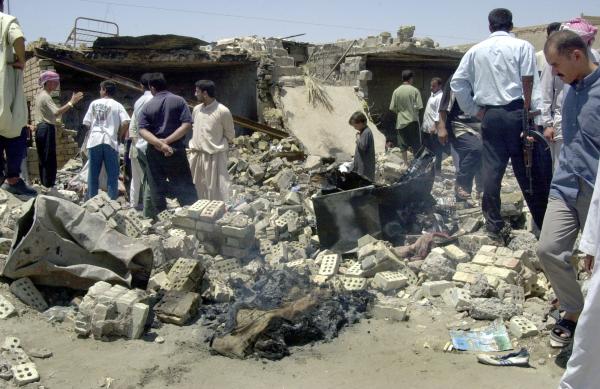 Fallujah residents sift through rubble from U.S. airstrike.