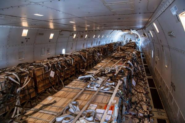 At Travis AFB, California, airmen load cargo on a Boeing 757 to go to Ukraine.