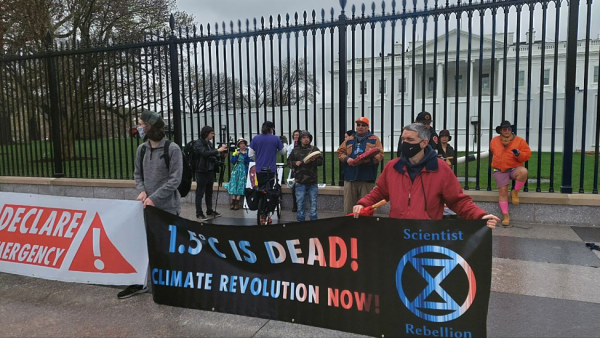 Scientist Rebellion protesters hold banner in front of White House, Washington, DC.