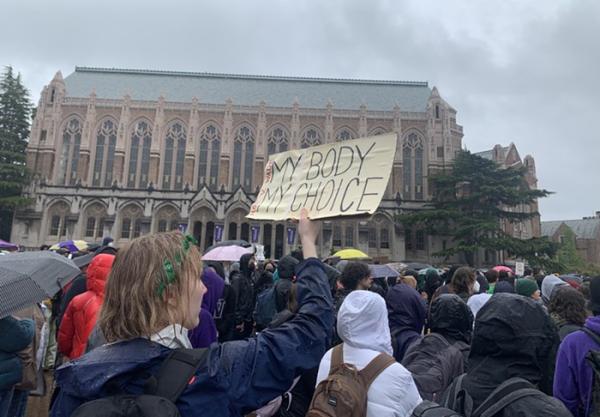 University of Washington students walk out in the rain for abortion rights.