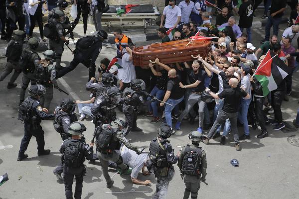 Mourners carrying coffin of Shireen Abu Akleh are attacked by Israeli police.