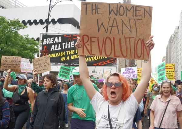 New York City RU4AR march with sign Women Want Revolution