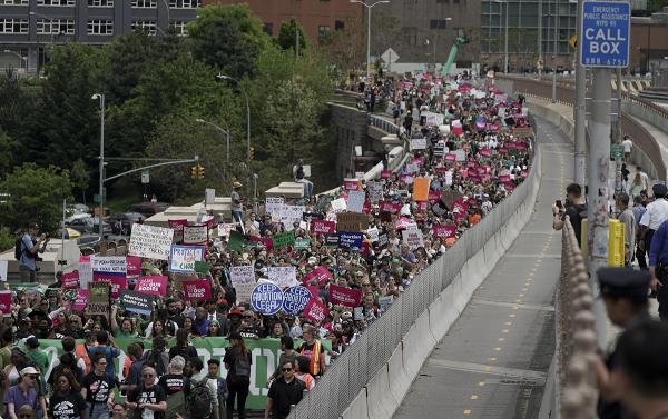 Thousands in New York City march across Brooklyn Bridge for abortion rights.