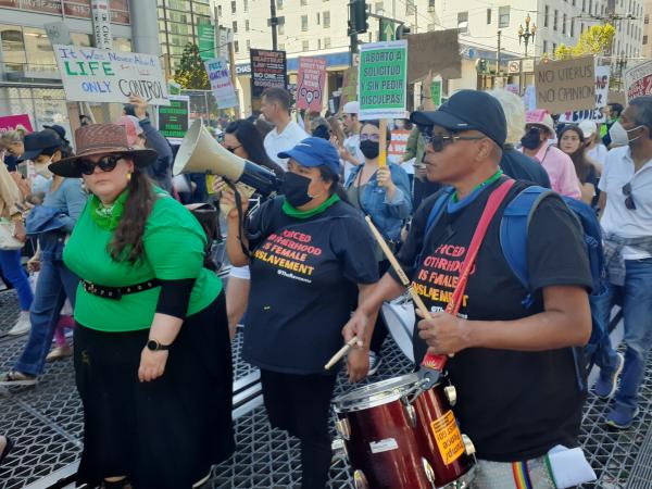 San Francisco RU4AR marching down Market St. with drum.