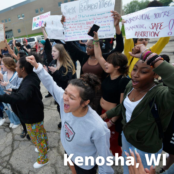 Kenosha, Wisconsin students with fists in the air for abortion rights.