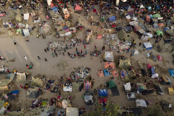 Aerial view of thousands of immigrants camp in squalid conditions under bridge in Del Rio, Texas.