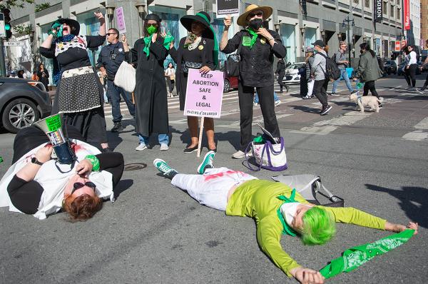 Rise Up 4 Abortion Rights activists stage a die in on busy Market Street, San Francisco.
