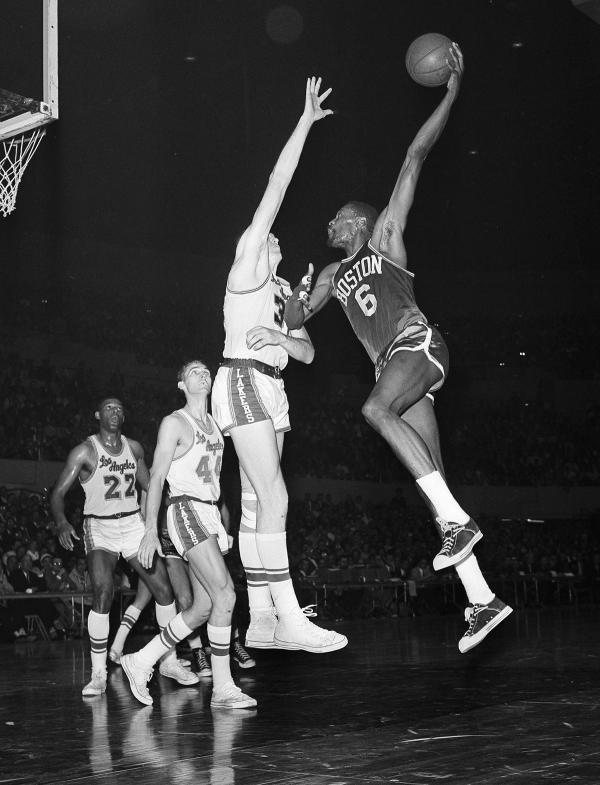 Boston Celtics Bill Russell in the air, at April 1962 game with Los Angeles Lakers.