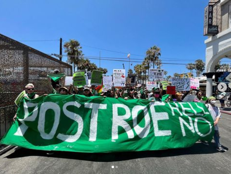 Los Angeles July 4 March led by green banner "Post Roe, Hell No"