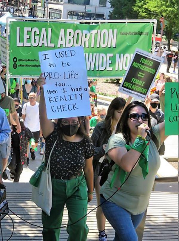 Chicago rally RU4AR sign: "I used to be pro-life, then I had a reality check."