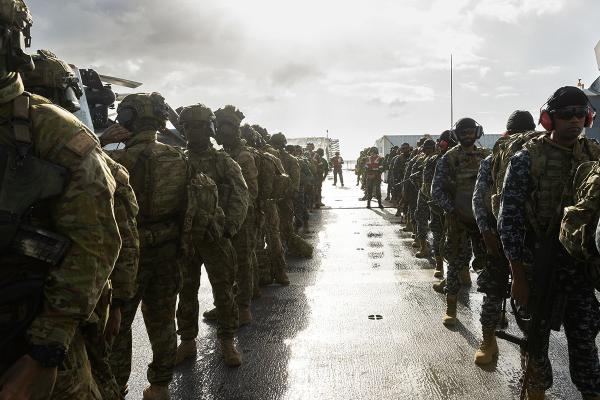 International coalition of armed forces from Australia, Malaysia, Sri Lanka, on Australian Navy vessel practice drills.