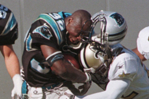 1998, Carolina Panthers’ Fred Lane loses his helmet in a hard tackle.