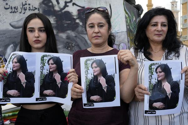 In Beirut, Lebanon, Kurdish women activists hold portraits of Iranian Mahsa Amini.