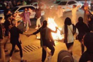 Iranian women without hijabs dance around a bonfire in Bandar Abbas, Hormozgan province, September 22, 2022.