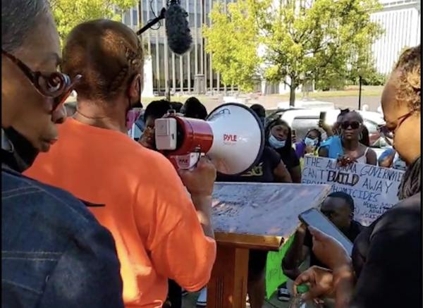 September 26, 2022: A woman whose brother was one of three inmates to die from medical neglect in the last two months at the Bibb “Correctional Facility” speaks at a "Break All the Chains" rally outside the Alabama State House in Montgomery.