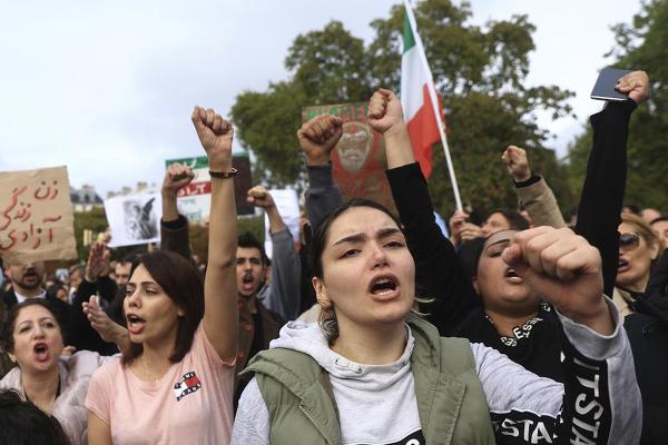 In Paris, October 2, 2022, women shout slogans to show support for Iranians, and to protest death of Mahsa Amini.