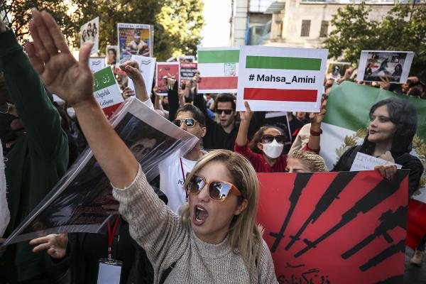 Outside consulate in Istanbul, Turkey, Iranian women shout slogans against morality police in Iran.