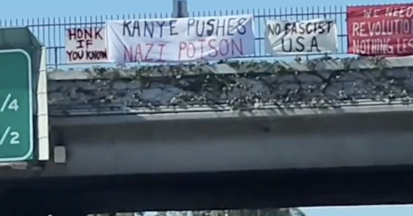 Banners over freeway: Kanye Pushes Nazi Poison, No Fascist USA, We Need Revolution Nothing Less