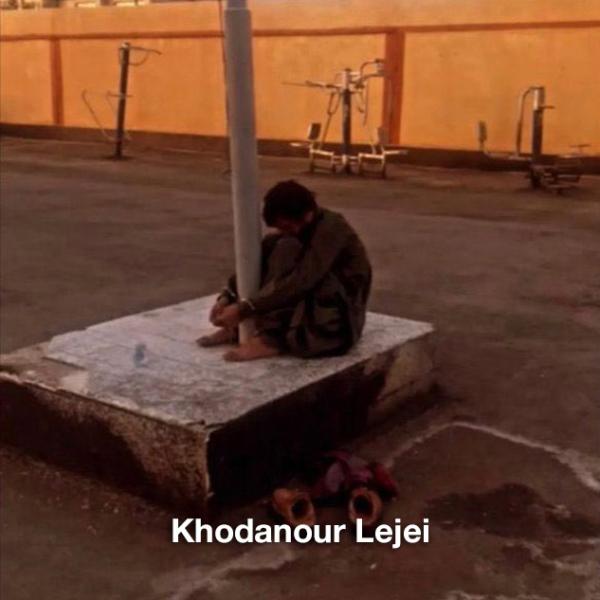 Khodanour Lajei, being tortured by being shackled to a pole.